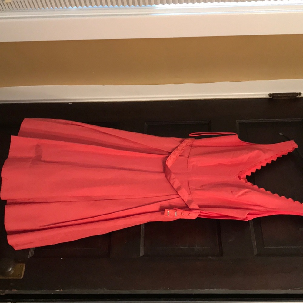 A never worn coral dress with bow detail size 2